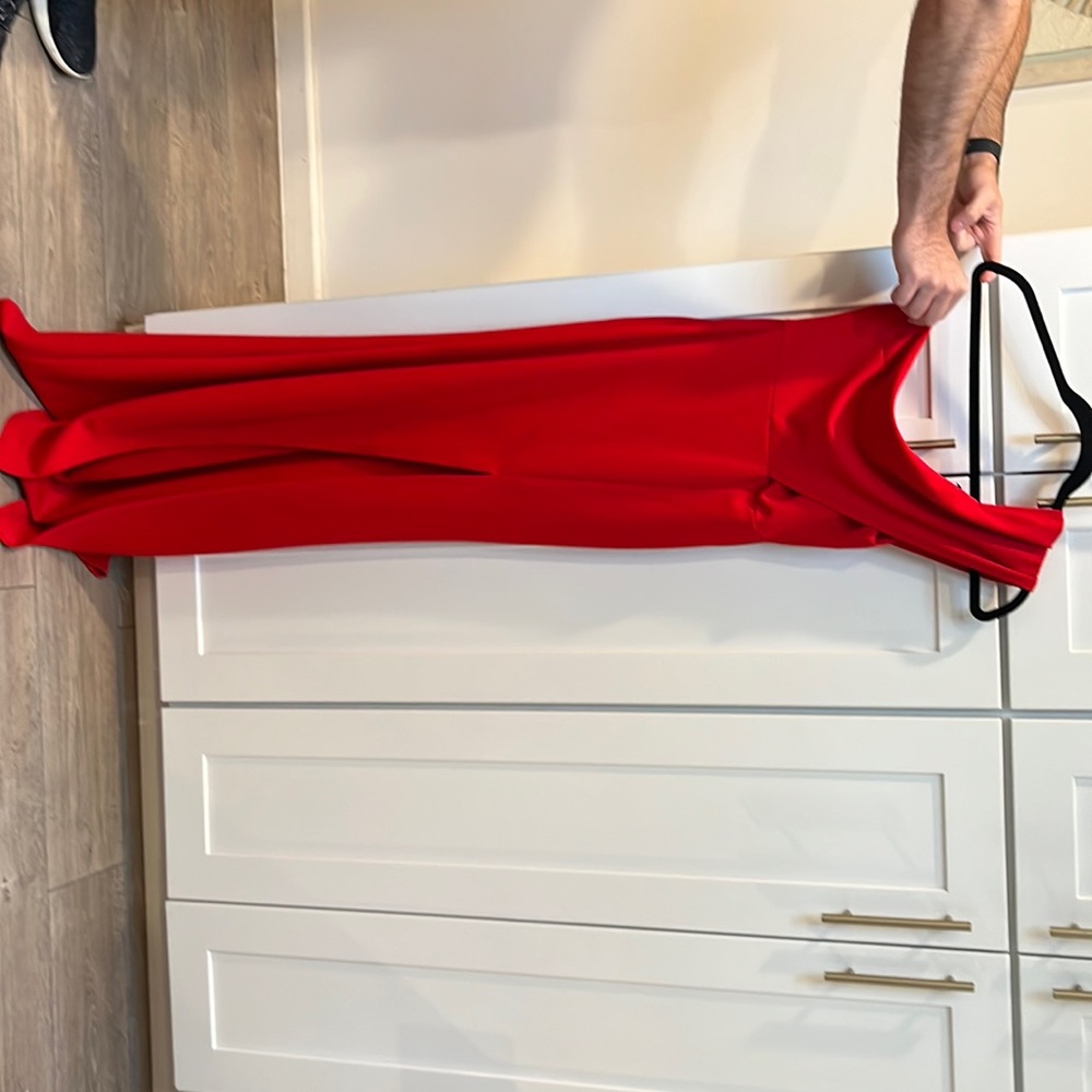 Red one shoulder gown with slit
